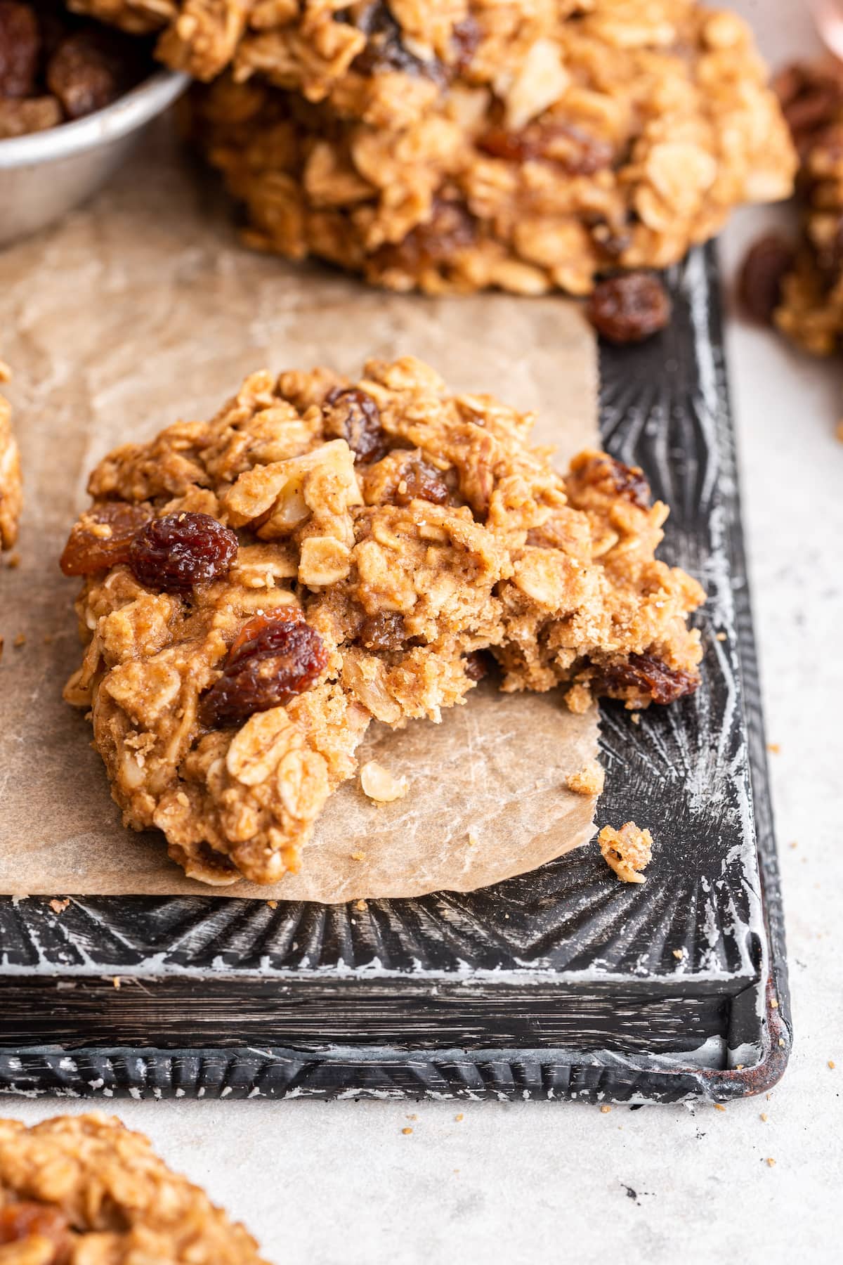 An oatmeal breakfast cookie with a bite taken from it.