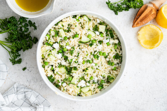 Lemon orzo salad in a white bowl.