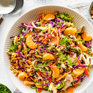 Mandarin orange chicken salad in a large white serving bowl.