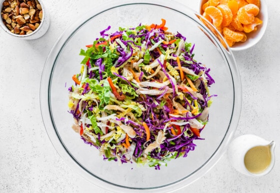 Mandarin orange chicken salad in a large glass bowl.