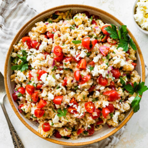 Mediterranean brown rice salad in a large bowl.