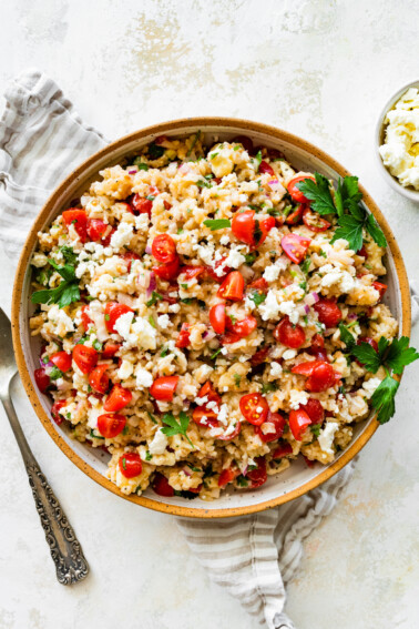 Mediterranean brown rice salad in a large bowl.