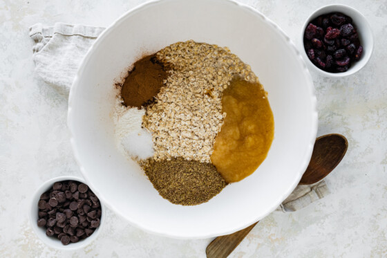 Ingredients for the oatmeal breakfast bars in a large mixing bowl.