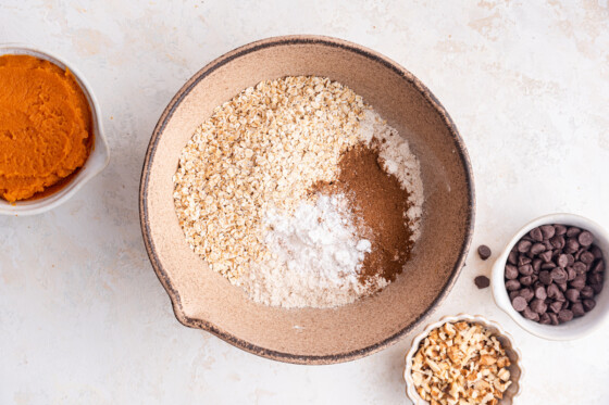 All the dry ingredients in for the pumpkin oatmeal bars in a large mixing bowl.