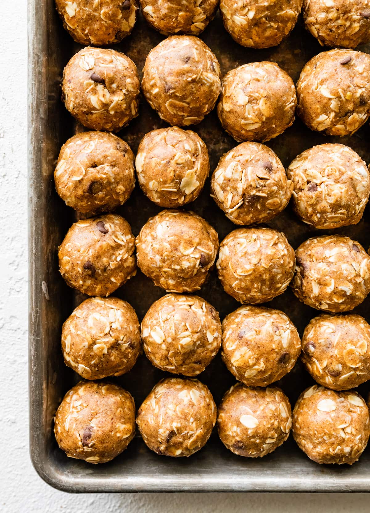 Vegan protein balls on a baking tray.