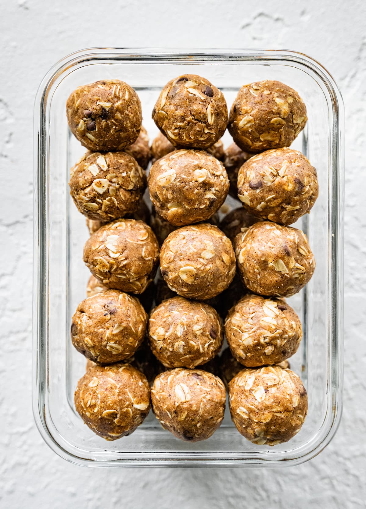 Vegan protein balls in a glass container.
