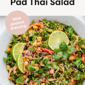 Kale & Cabbage Pad Thai Salad in a serving bowl with spoons.