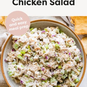 Bowl of chicken salad with a spoon.