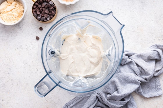 A blender with cottage cheese inside.