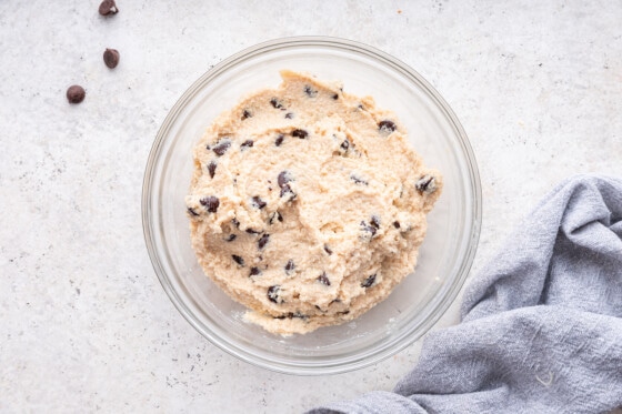 A large glass bowl containing cottage cheese cookie dough.