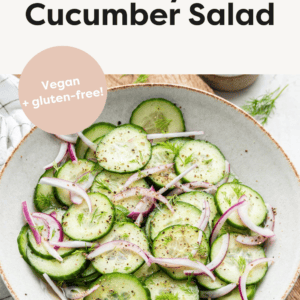 Serving bowl with a cucumber red onion salad.