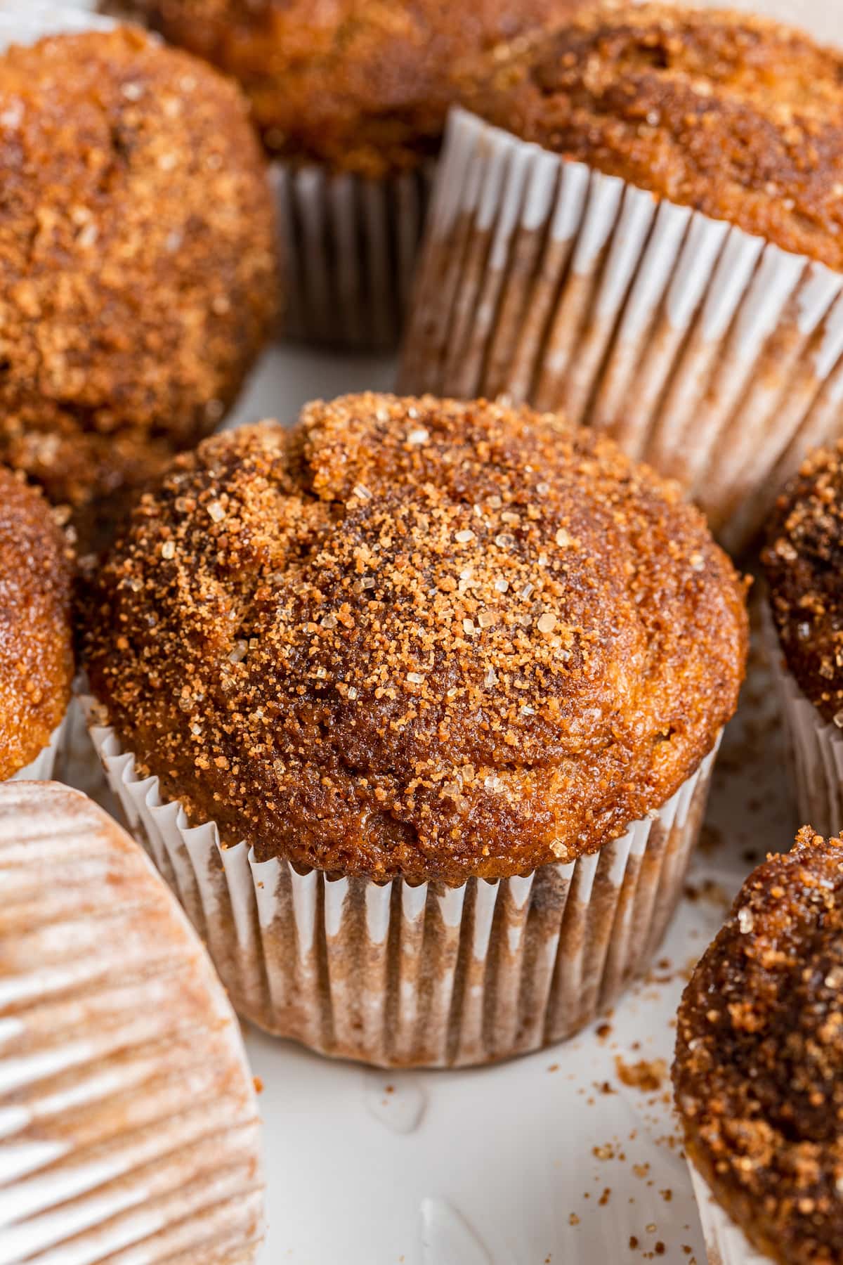 A sweet potato muffin topped with cinnamon sugar.