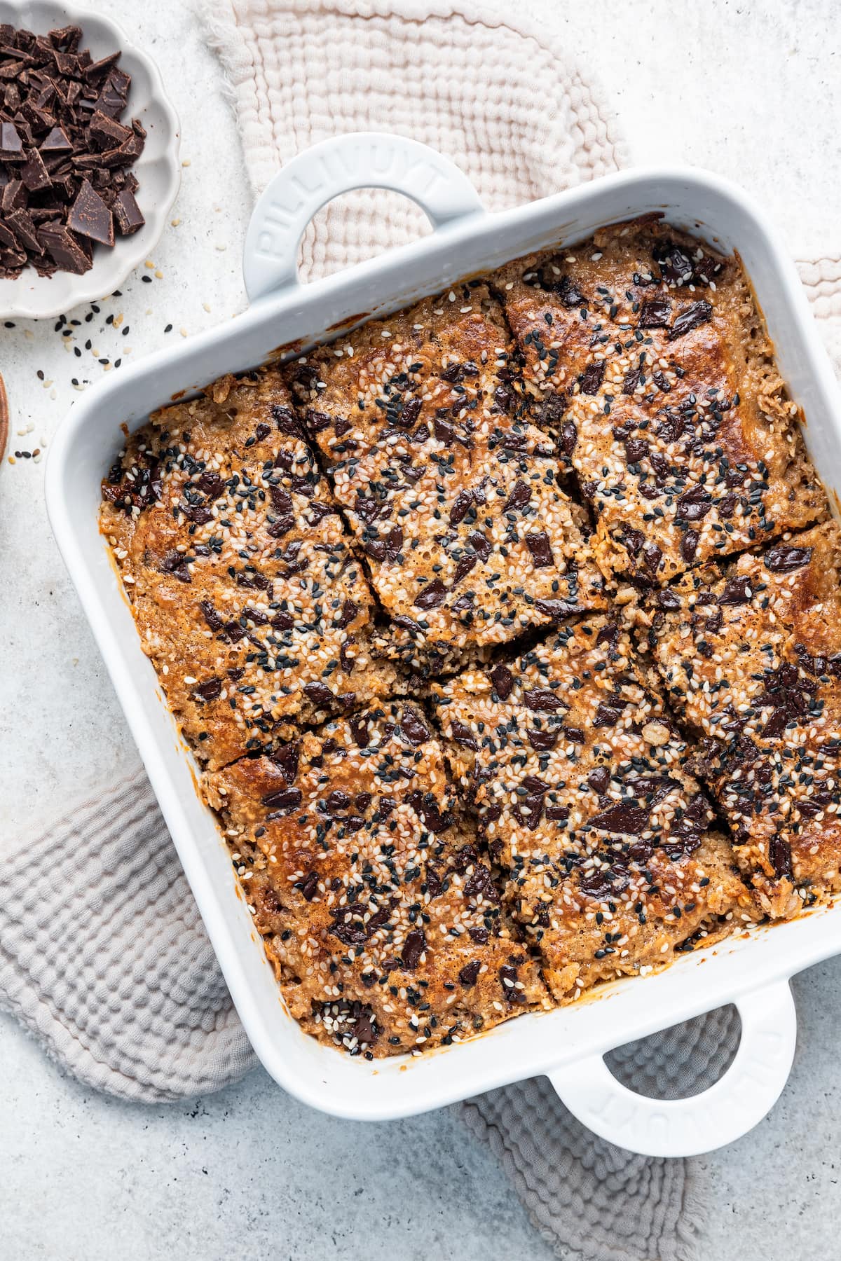 Tahini baked oatmeal in a square baking dish.