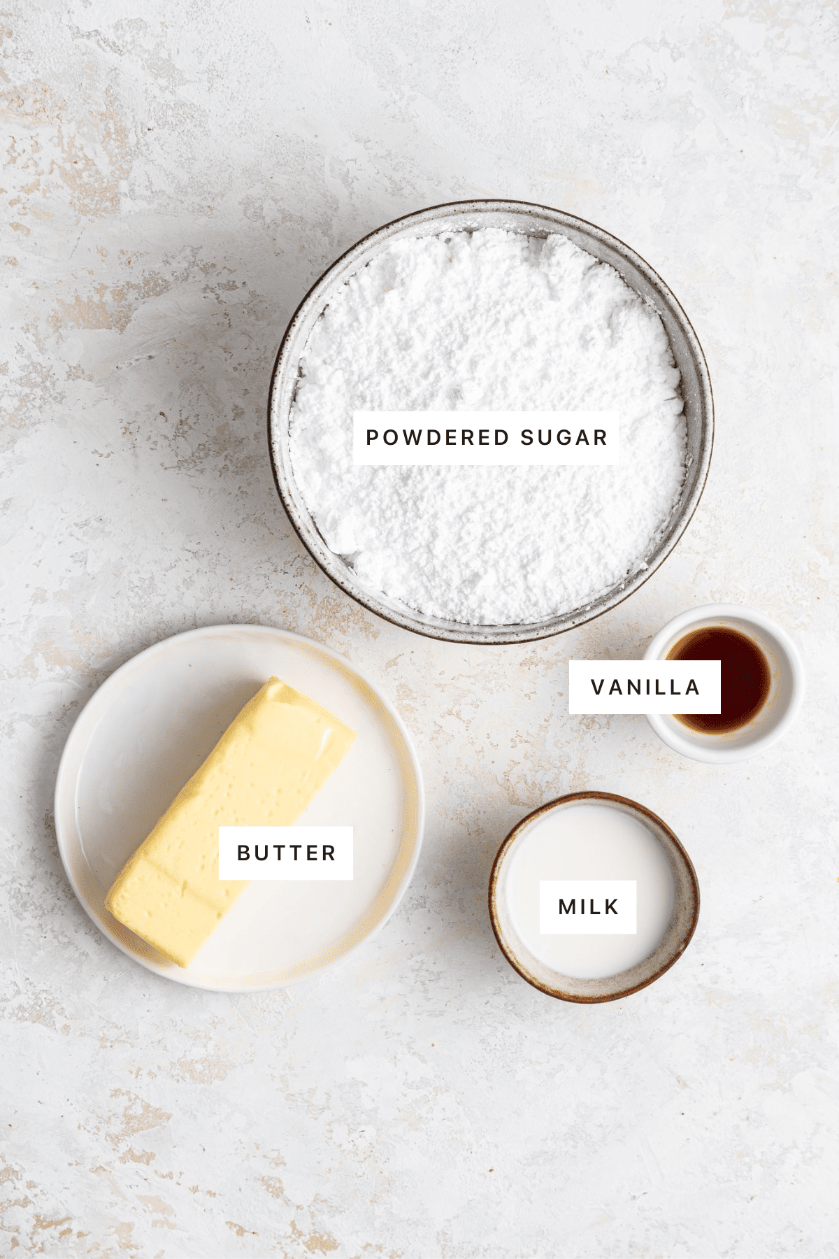 Ingredients for the vanilla buttercream bitumen: butter, milk, vanilla and icing sugar.