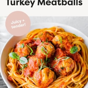 Baked Turkey Meatballs served with spaghetti and sauce.
