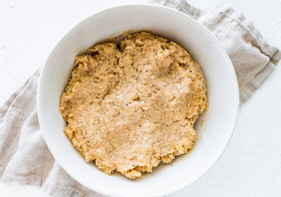 Baked turkey meatball mixture in a large white mixing bowl.