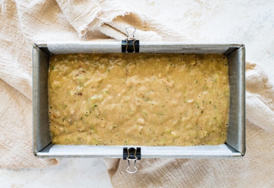 The healthy zucchini bread in a bread pan before being baked.