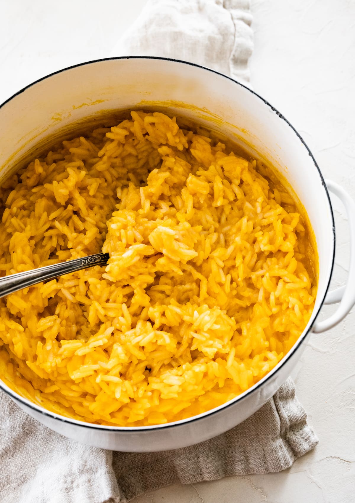 Pumpkin rice in a large white pot.