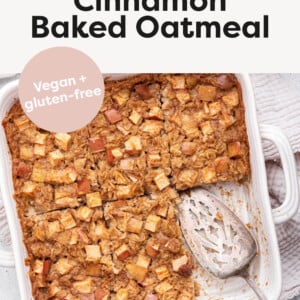 Apple Cinnamon Baked Oatmeal in a baking dish, cut into slices. Spatula is in the pan.