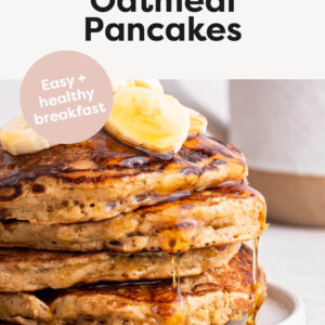 Stack of Overnight Oatmeal Pancakes topped with maple syrup and bananas.