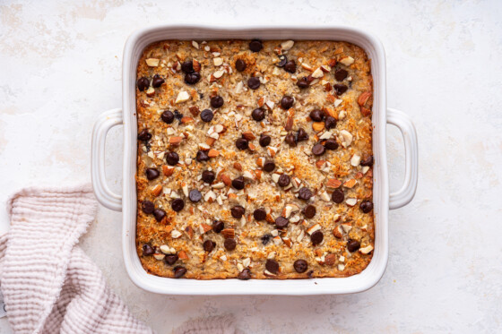 Almond joy baked oatmeal in a square baking dish after being baked.