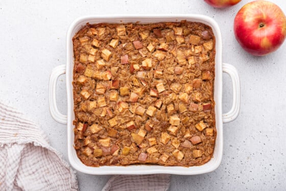 Apple cinnamon baked oatmeal in a square baking dish.