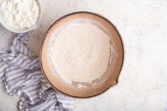 All the dry ingredients for the cottage cheese pancakes in a large mixing bowl.