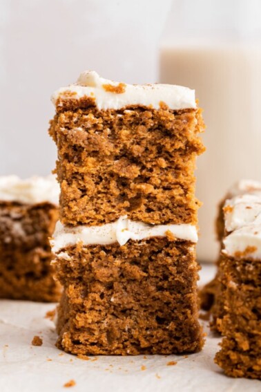 Two pieces of pumpkin cake stacked on one another.