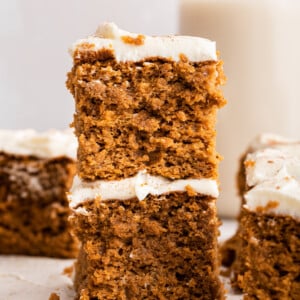 Two pieces of pumpkin cake stacked on one another.