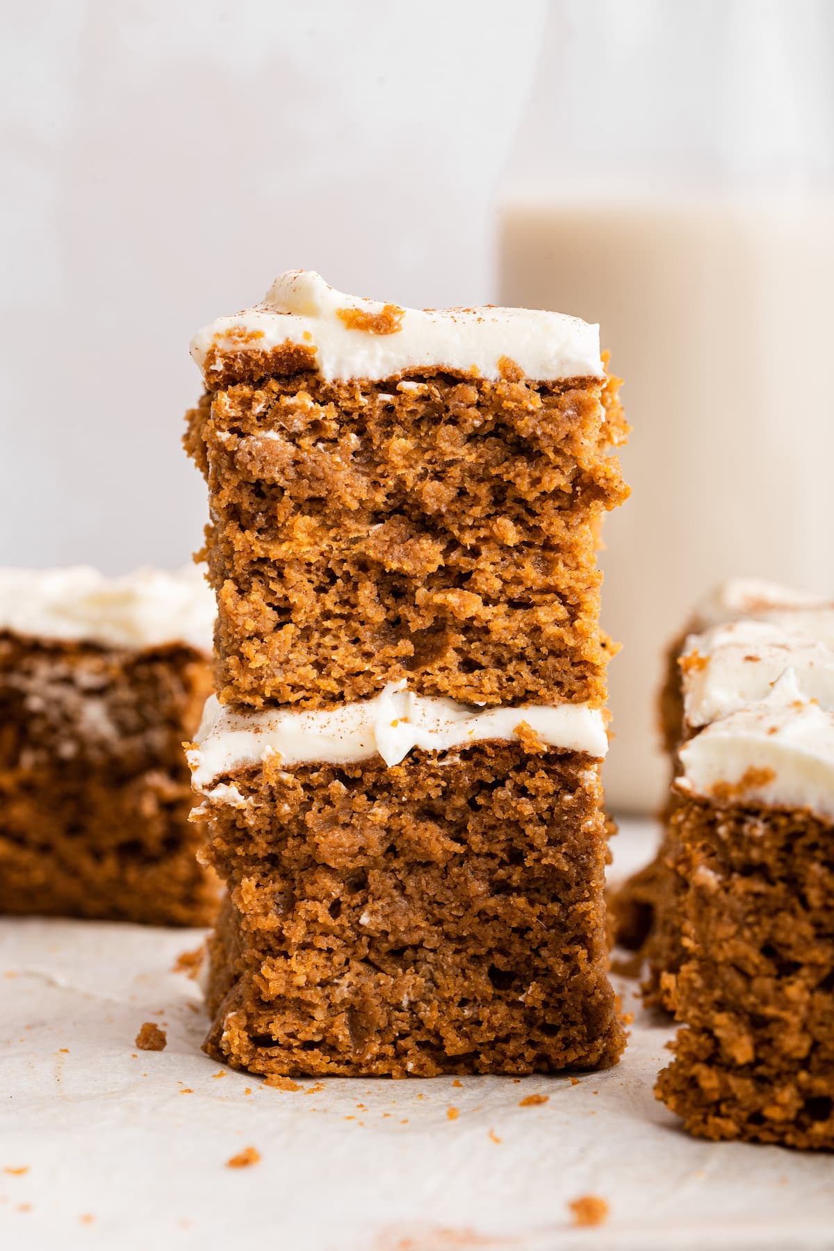 Two pieces of pumpkin cake stacked on one another.
