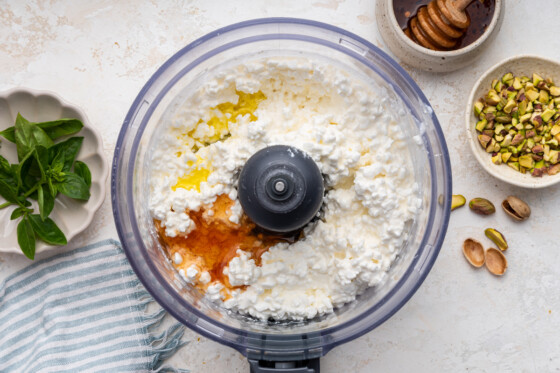 Cottage cheese, honey, and olive oil in a food processor.