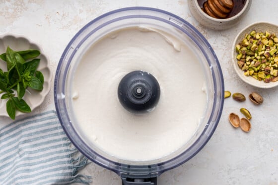 Hot honey whipped cottage cheese being blended in a food processor.