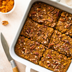 Pumpkin baked oatmeal in a square baking dish cut into 6 pieces.