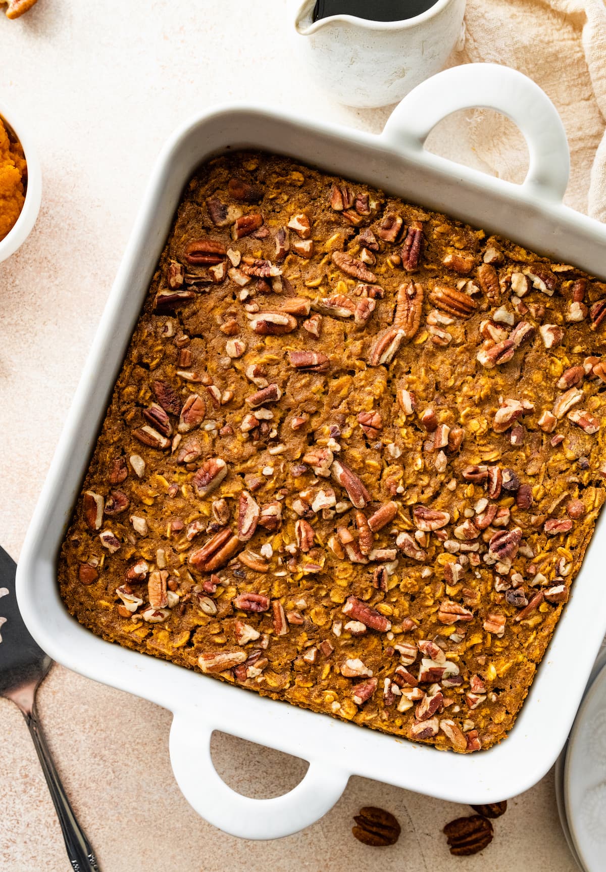 Pumpkin baked oatmeal in a square baking dish.