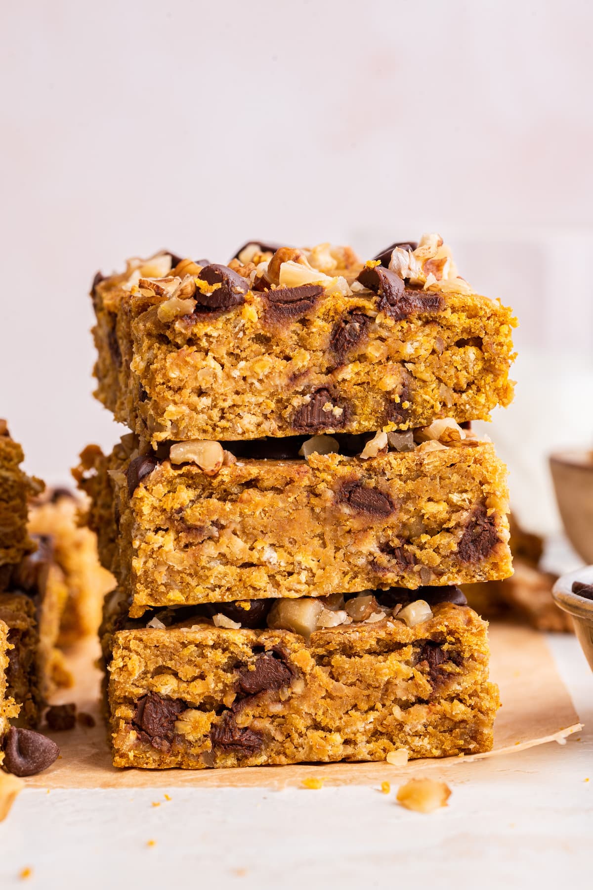 Three pumpkin oatmeal bars stacked on one another.