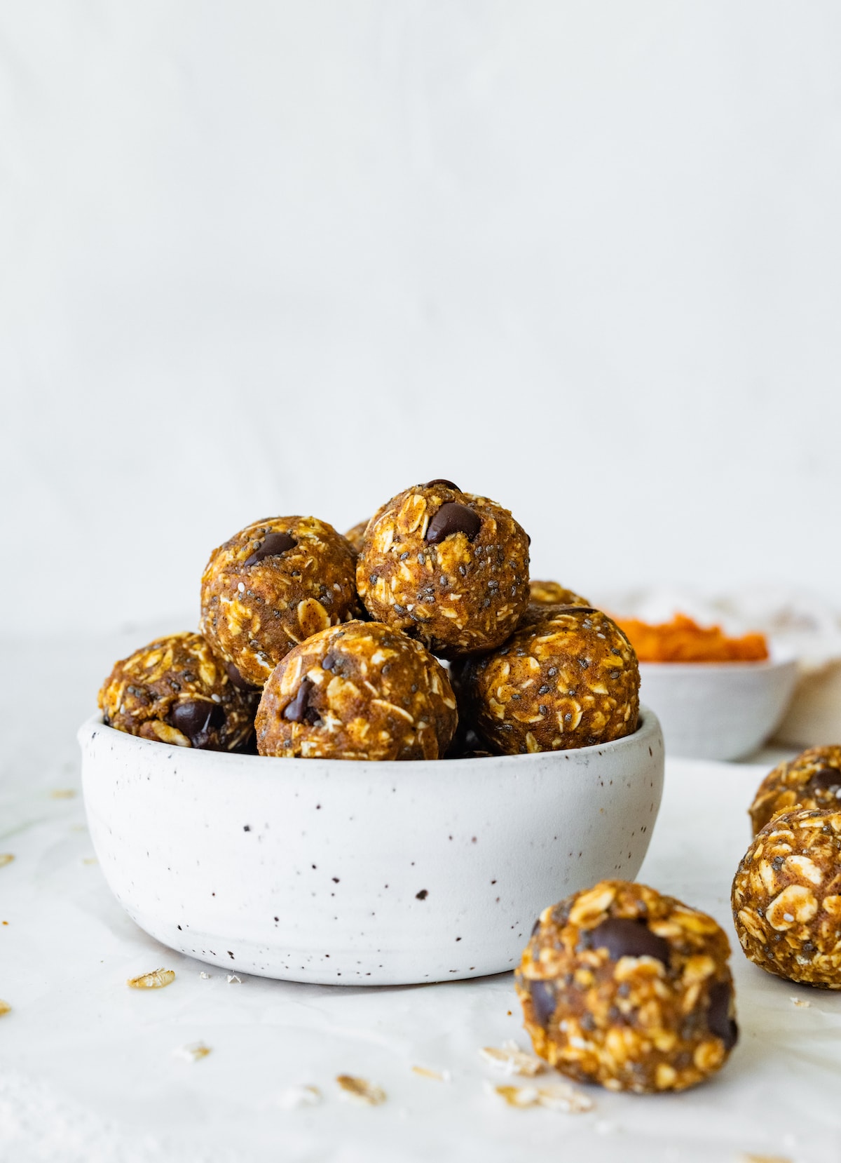 Pumpkin protein balls in a small bowl.