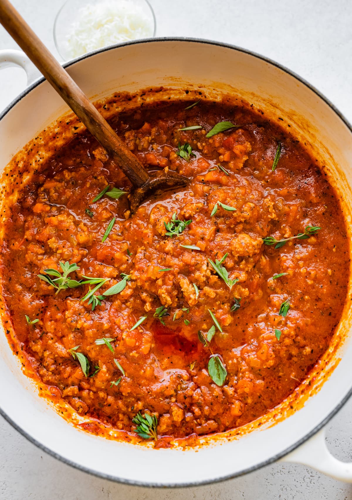 Turkey bolognese being cooked in a large dutch oven.