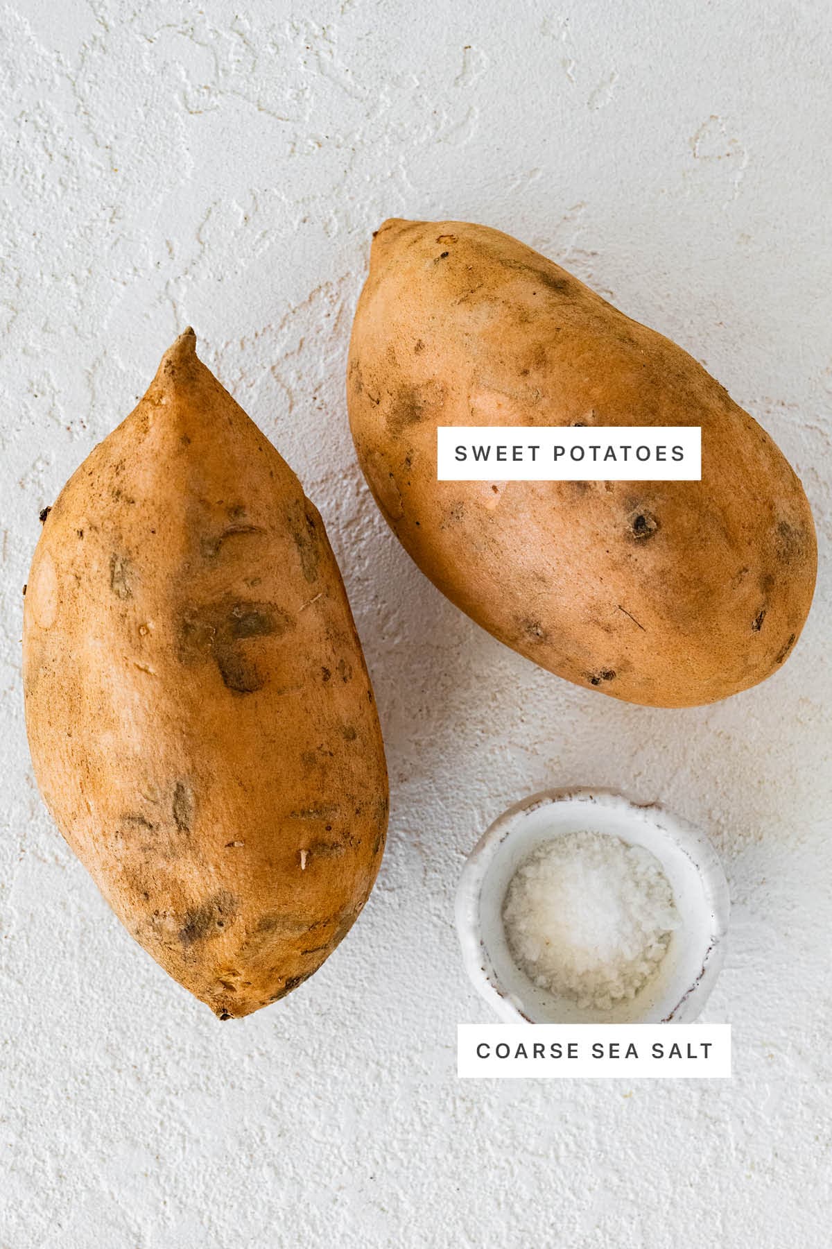 Ingredients measured out to make Air Fryer Baked Sweet Potato: sweet potatoes and coarse sea salt.