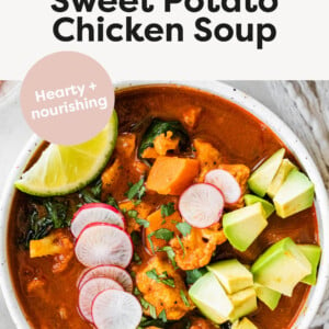 Bowl of Mexican Sweet Potato Chicken Soup topped with avocado, radishes, cilantro and lime.