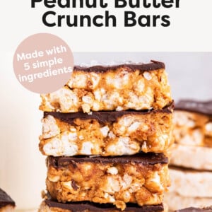 Four No Bake Peanut Butter Crunch Bars stacked on top of each other.