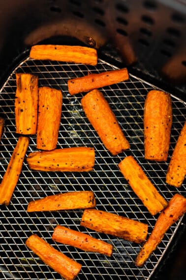 Carrots cut into matchsticks in an air fryer.