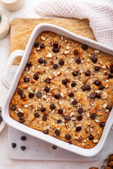 Almond joy baked oatmeal in a square baking dish after being baked.