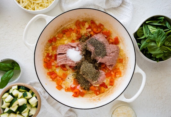 Ground turkey, seasonings, red bell pepper, onion, and garlic all in a large saucepan.