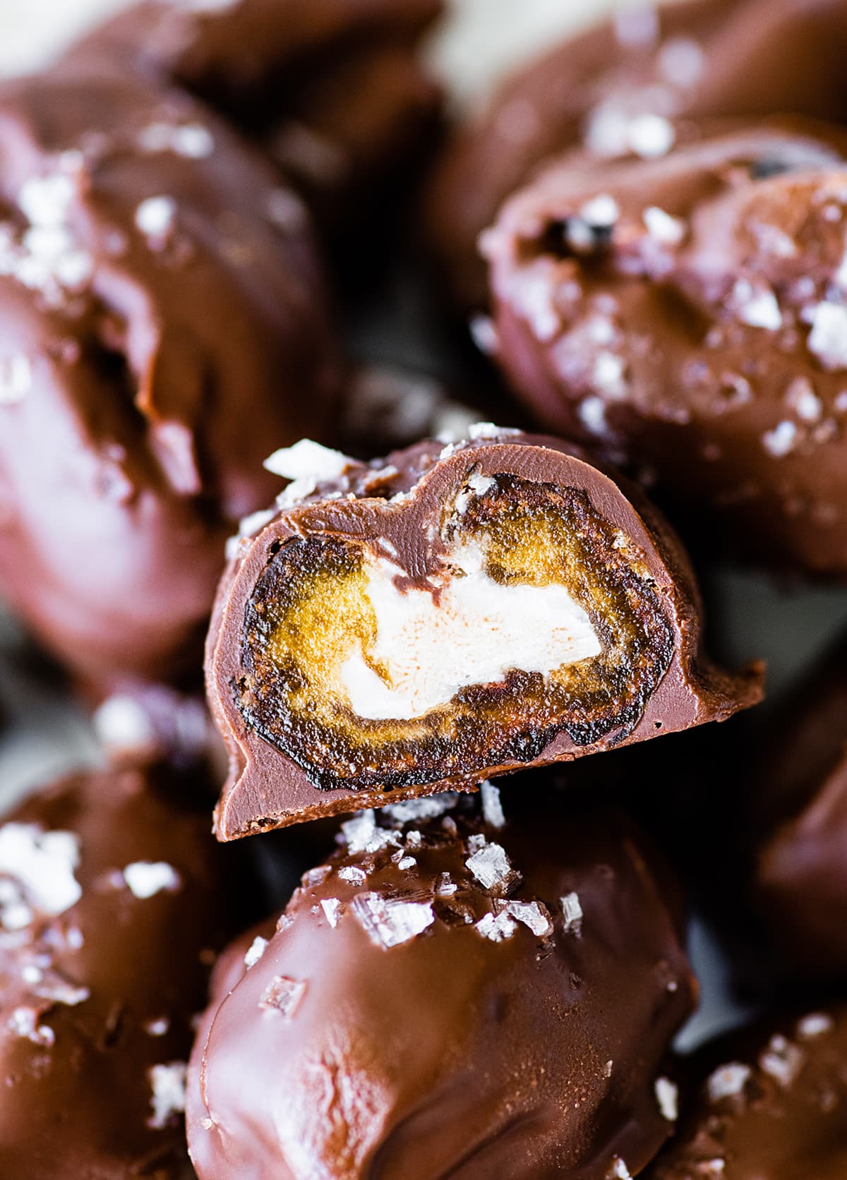 A date mounds bar showing the inside with a creamy coconut filling.