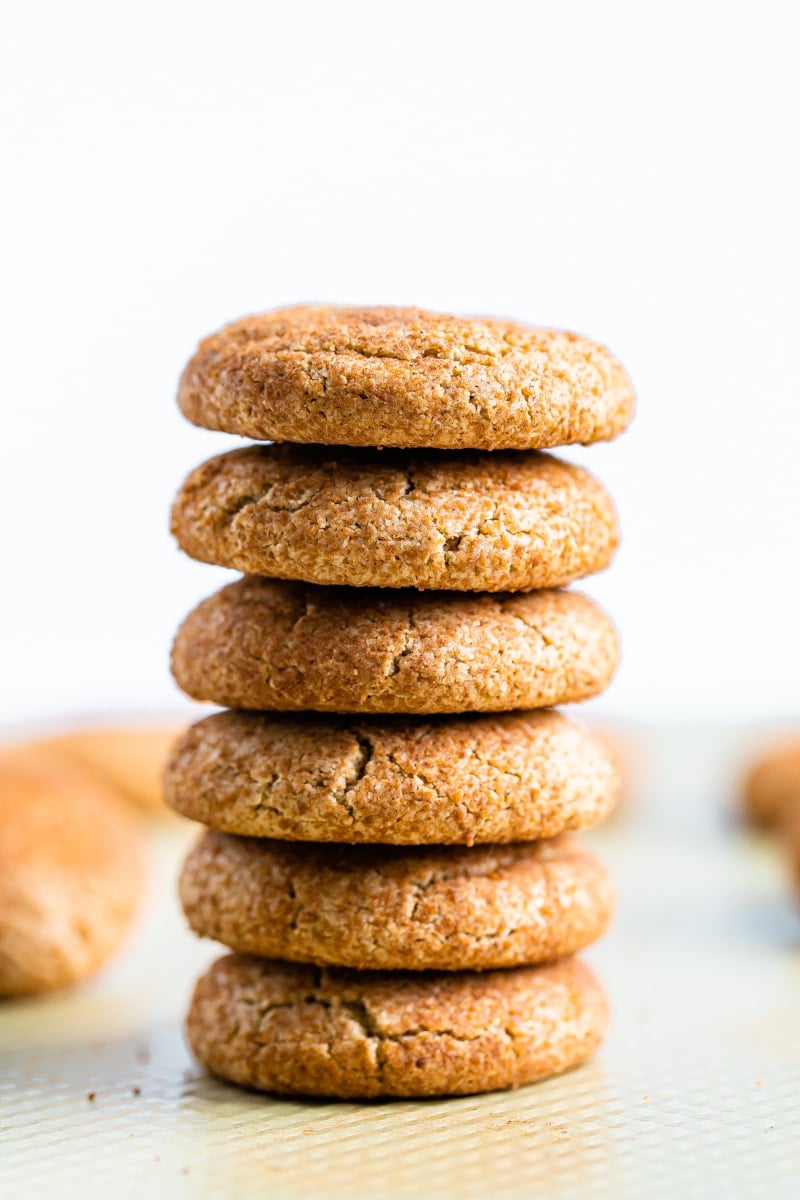 Six gluten-free snickerdoodle cookies stacked on one another.