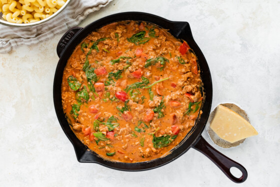 Pasta sauce with ground turkey in a large cast iron skillet.