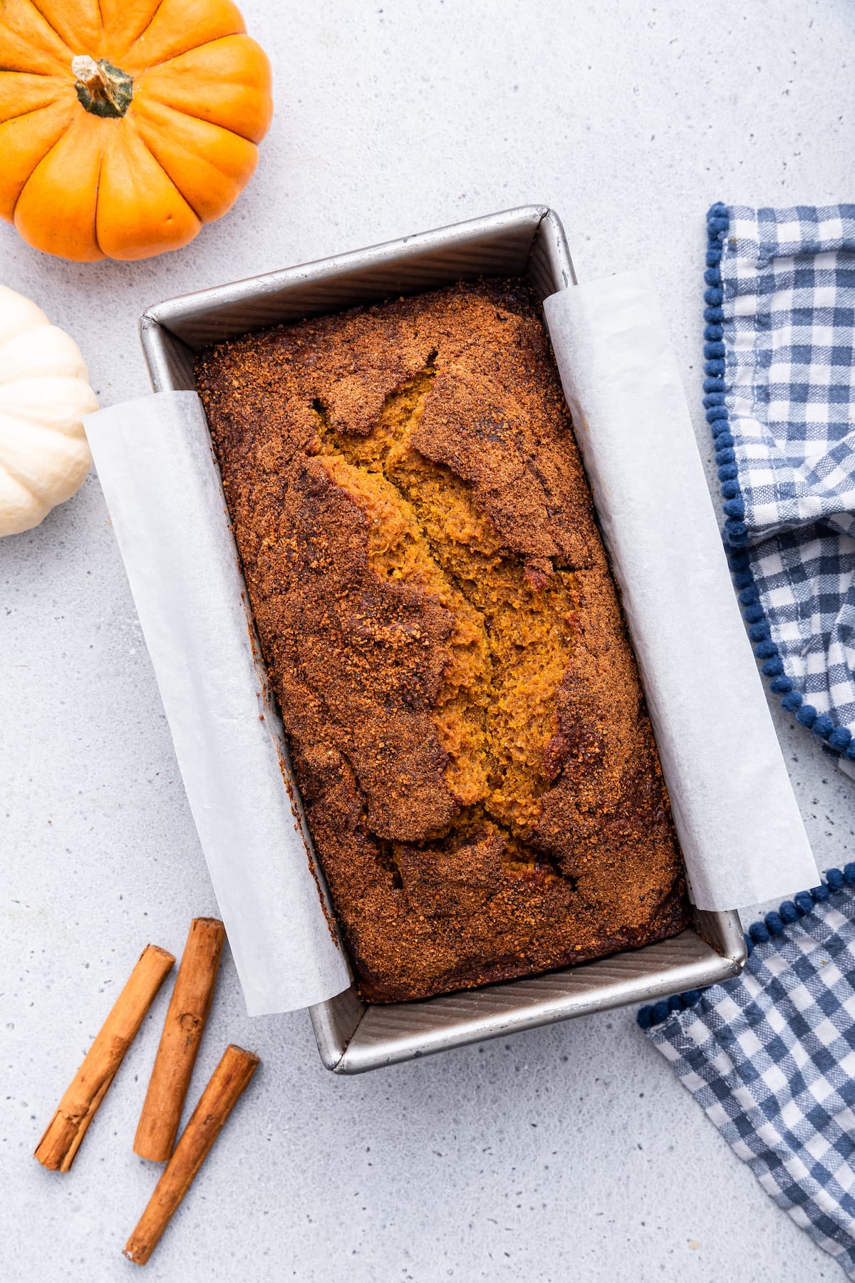A loaf of healthy pumpkin bread in a loaf pan.