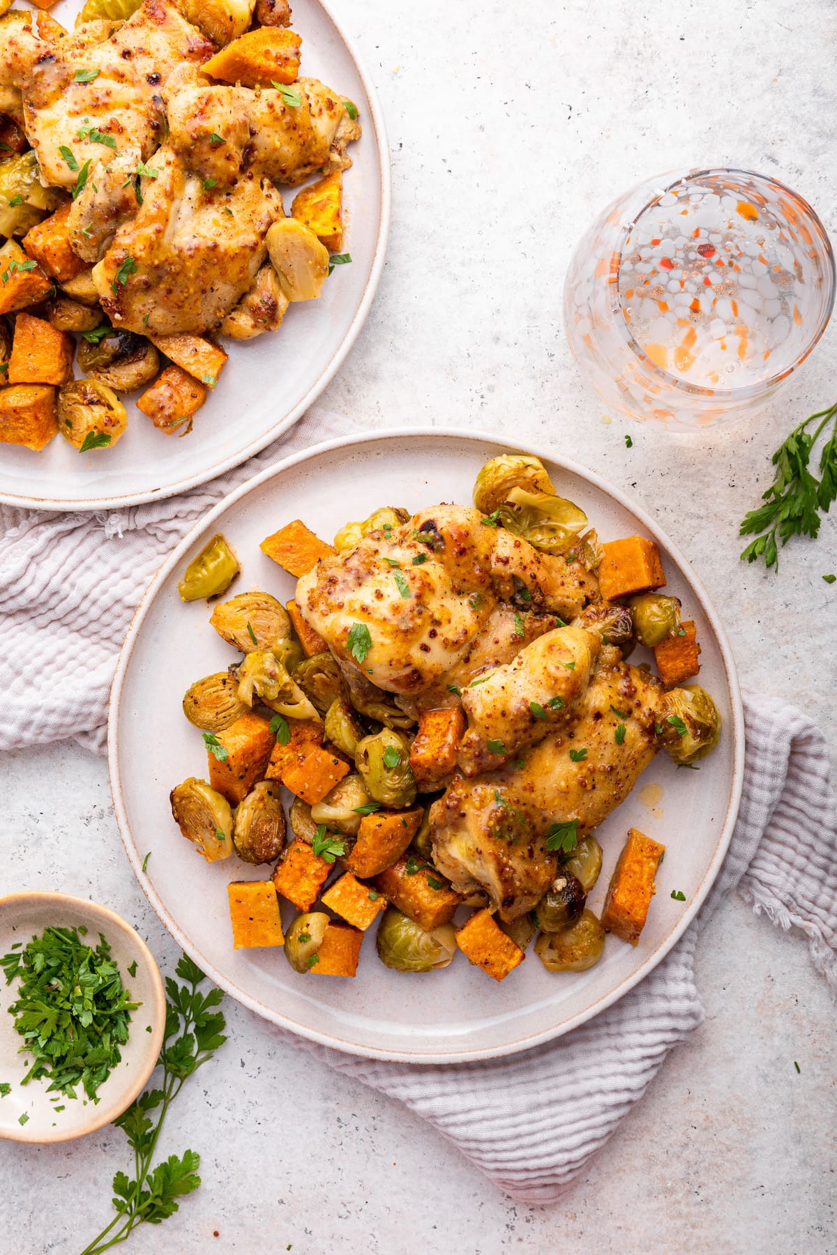 Honey mustard chicken sheet pan meal with roasted vegetables on a large plate.