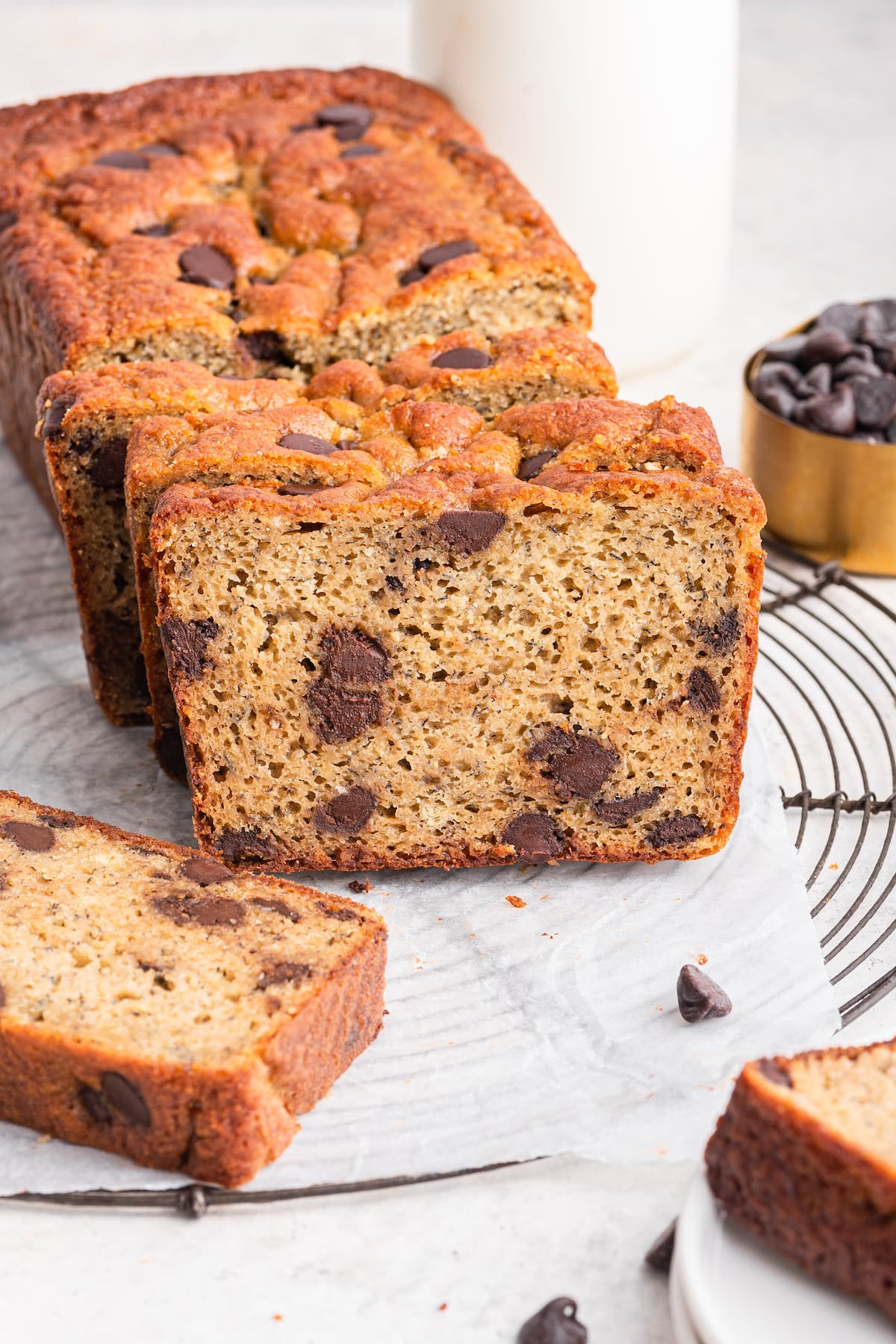 Protein banana bread cut into multiple slices showing chocolate chips on the inside of the bread.