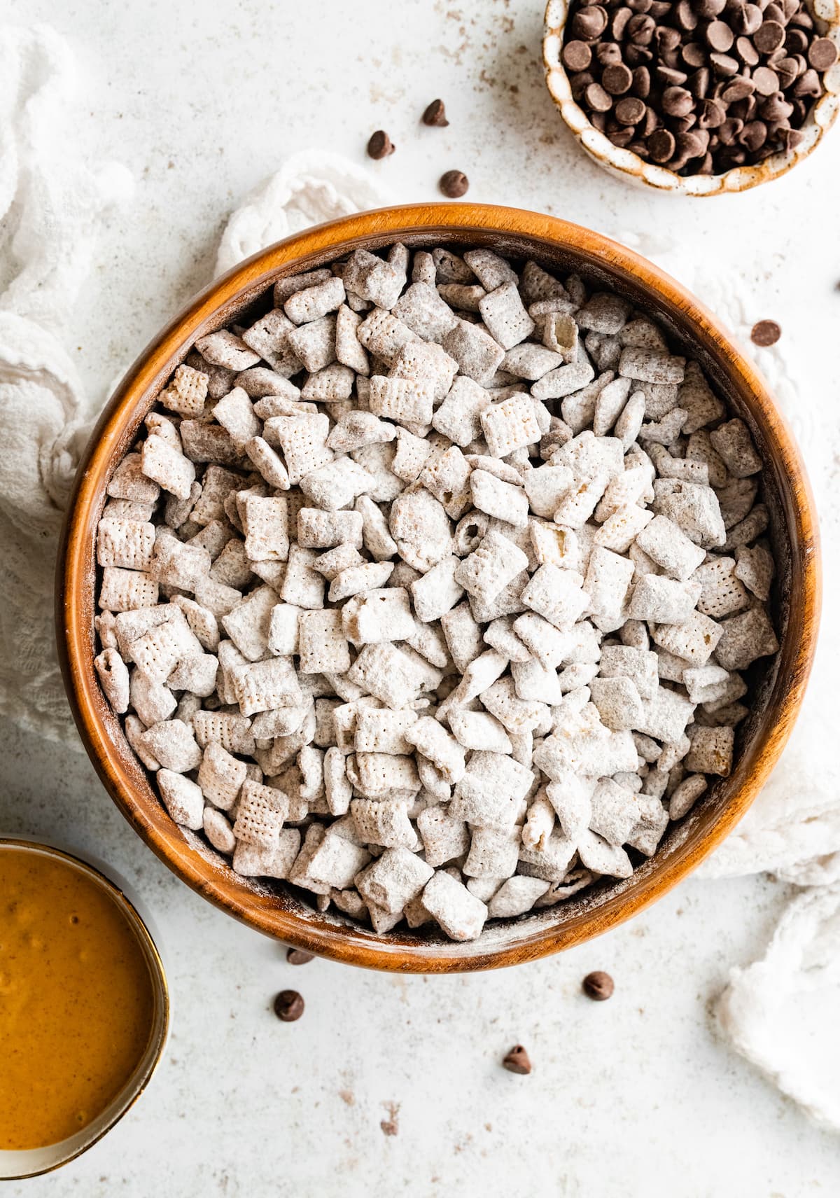 Puppy chow in a large wood bowl.